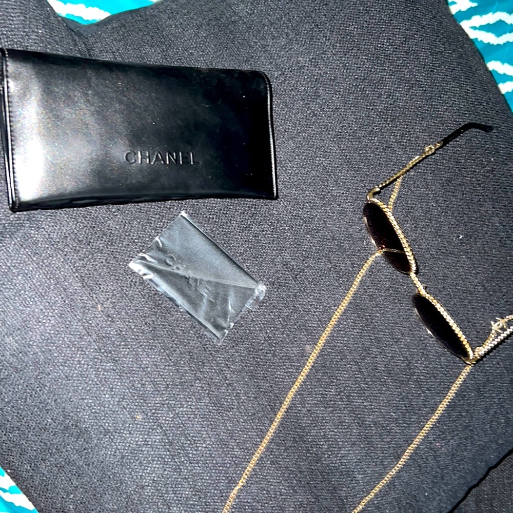 Authentic Chanel Sunglasses with removable Chanel chain. In case. Cloth included